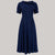 A 1940s vintage style short sleeve dress with a side tie-neck and a tie-waist belt. This dress is in a navy colour and has a a-line skirt and is designed to finish below the knee.