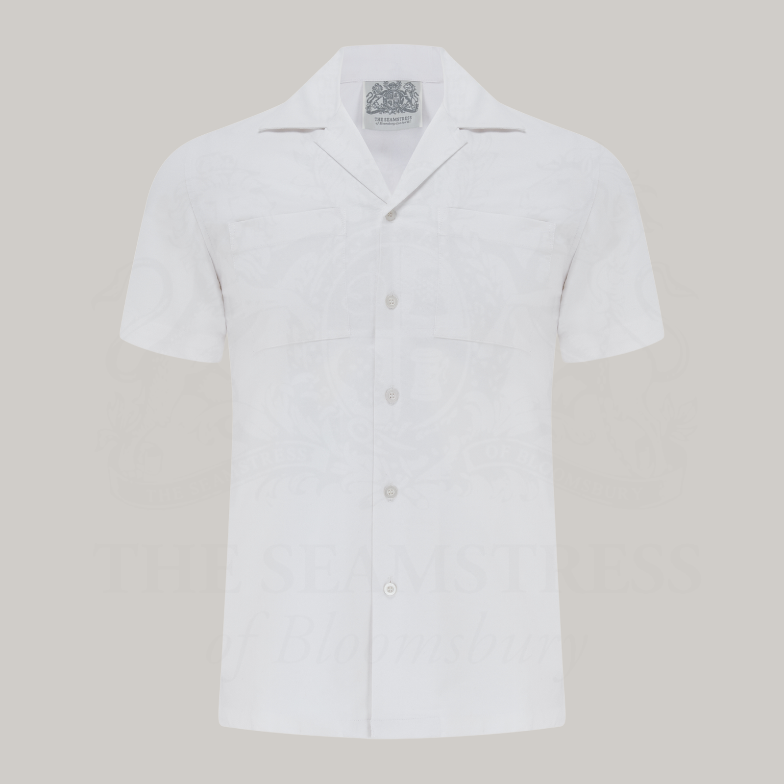 White short-sleeve shirt on a grey background