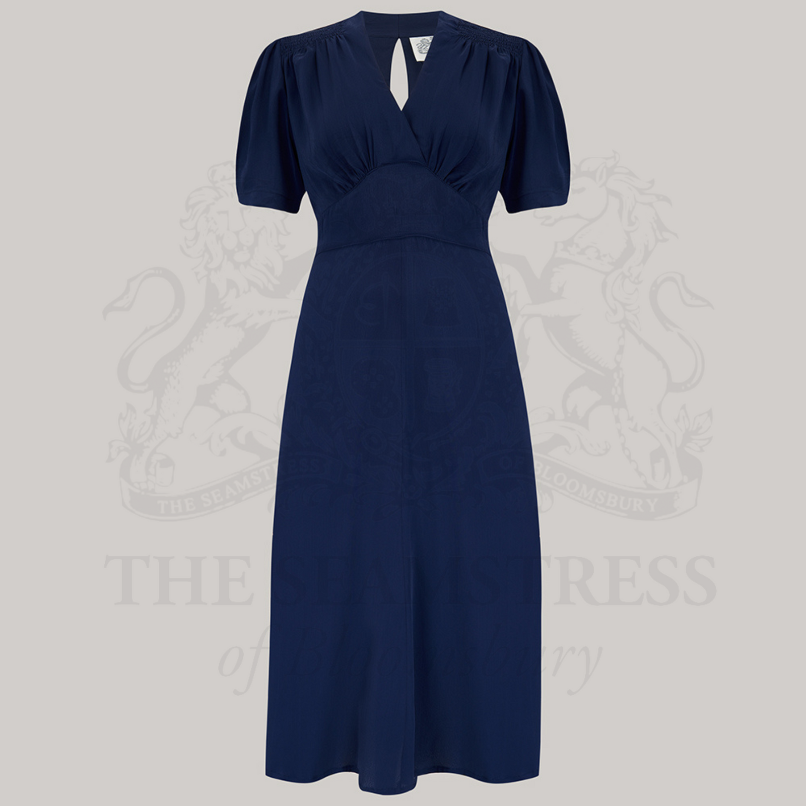 A 1940s-style short sleeve swing dance dress in navy blue.