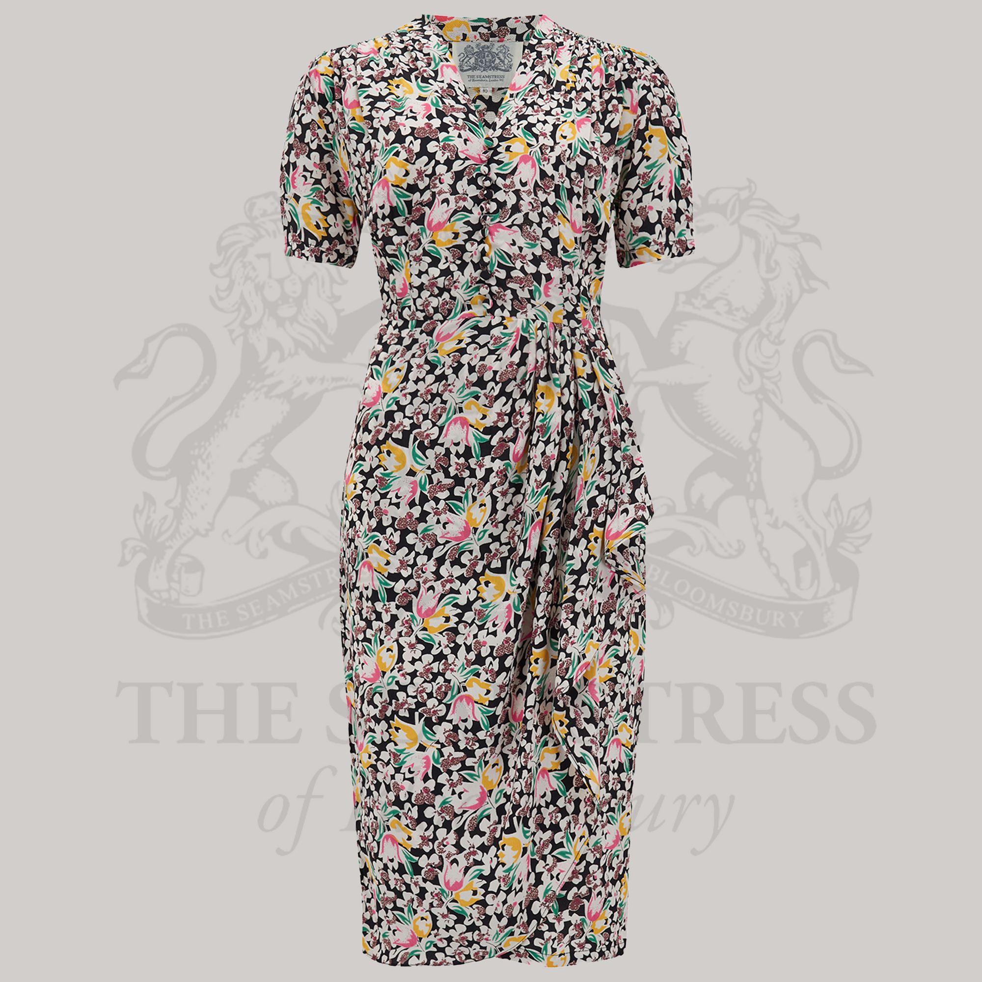 A floral print dress with a fitted style, short sleeves, and a V-neck.