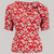 A 1940s-style short-sleeved red floral blouse. Featuring a side tie-neck collar and button fastenings down the back of the blouse.