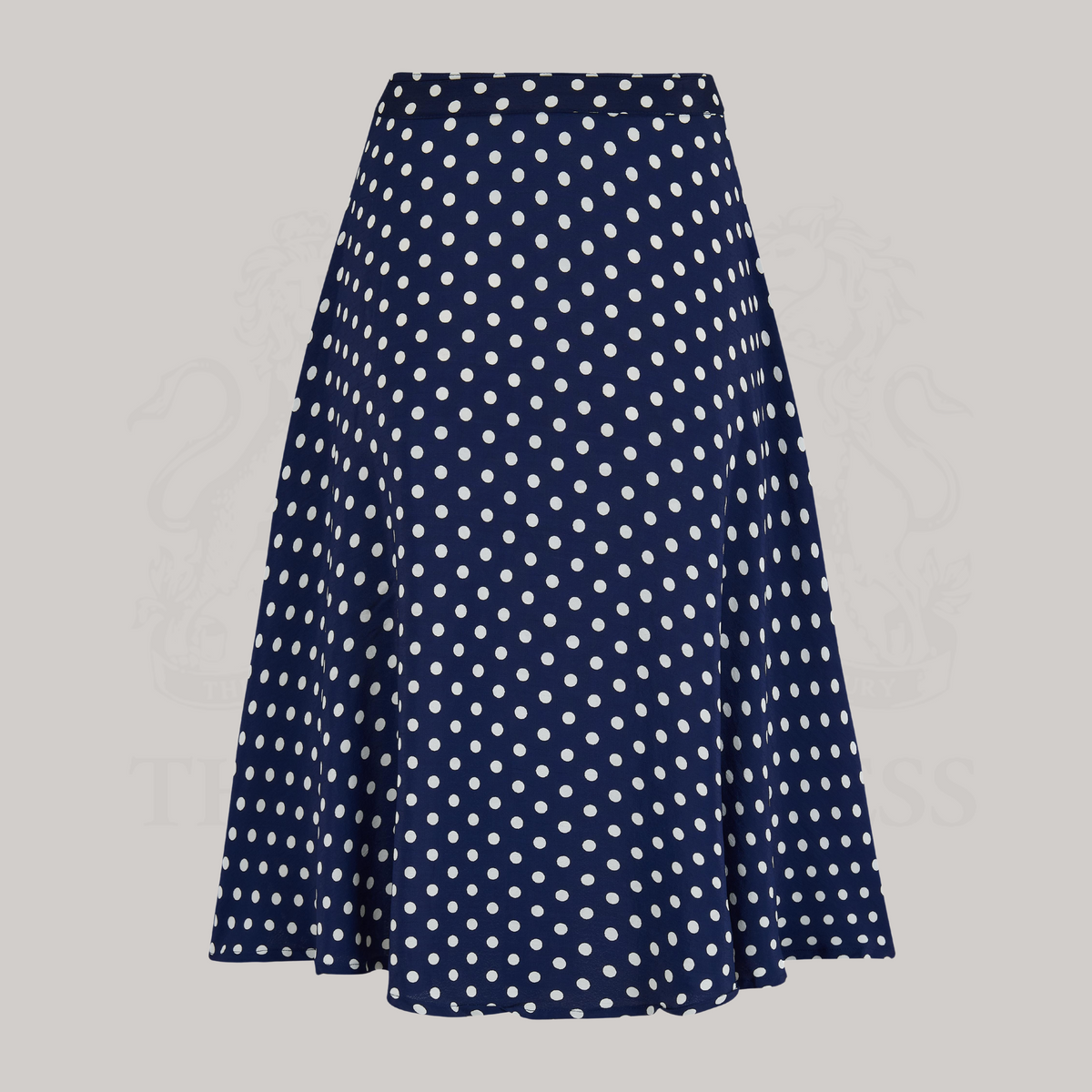 A 1940s-style swing dancing skirt in navy blue with polka dots. The skirt comes with a self-coloured waist belt. 
