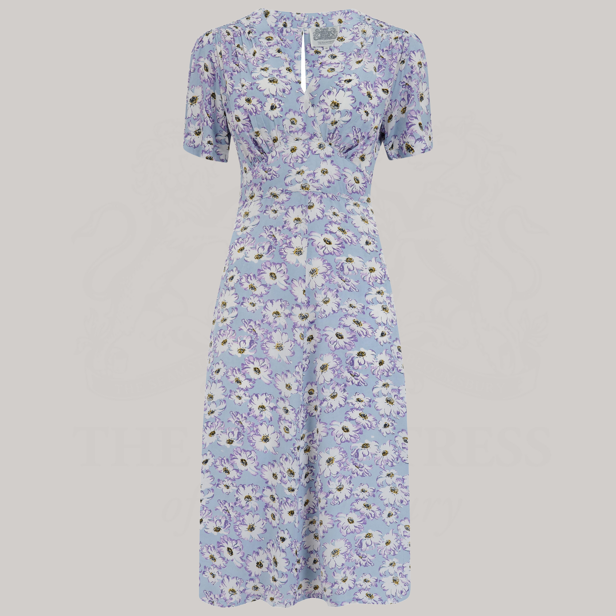 a 1940s-style dance dress in pale blue with a cream floral pattern
