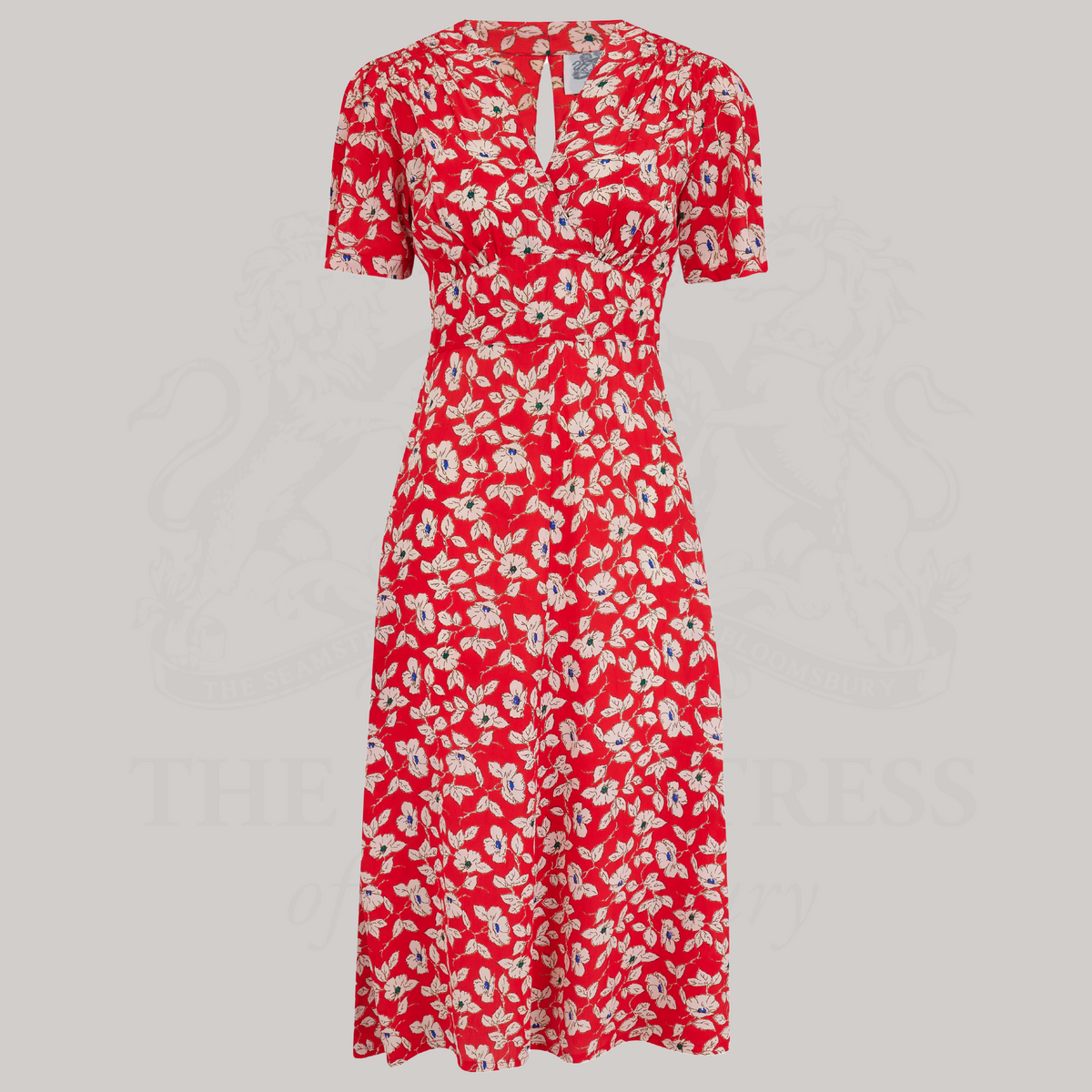 a 1940s-style swing dance dress in red with a cream floral pattern