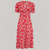 a 1940s-style swing dance dress in red with a cream floral pattern