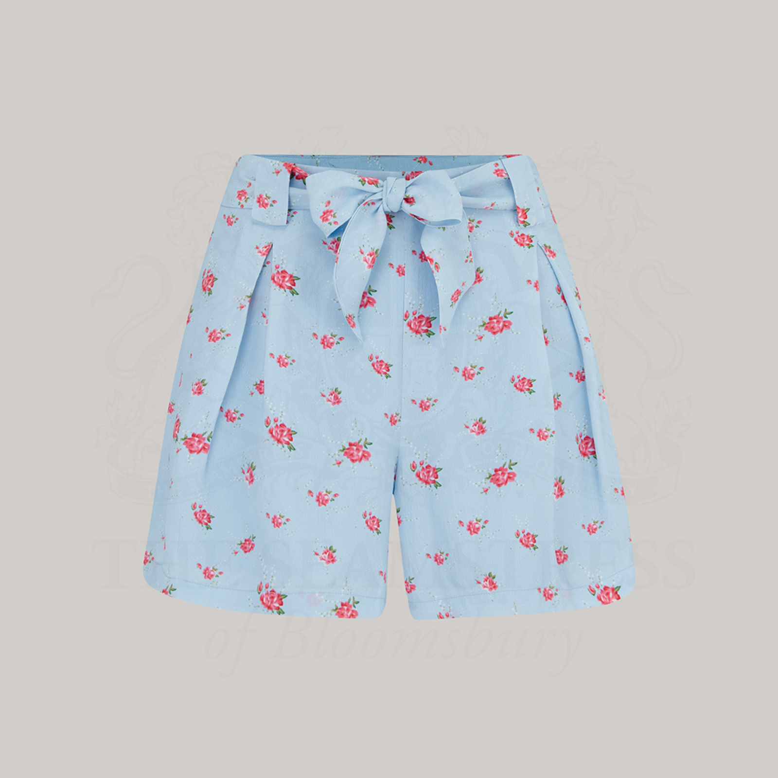  Powder blue shorts with a floral rose pattern, featuring a tie-waist belt.