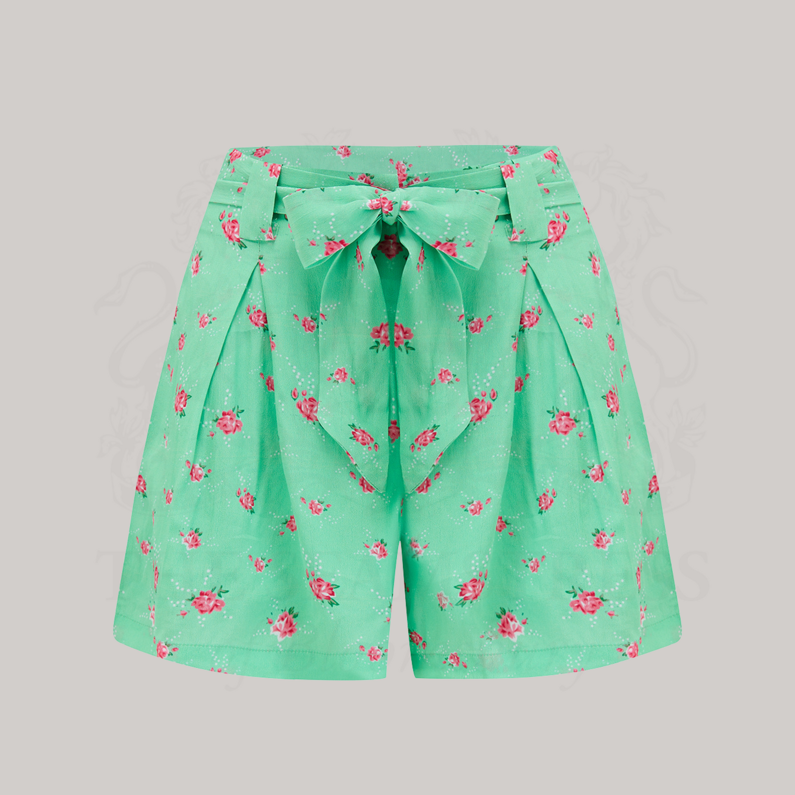 1940s-style paper bag waist shorts, with a tie-waist belt. These shorts are a mint colour with a pink floral design. 