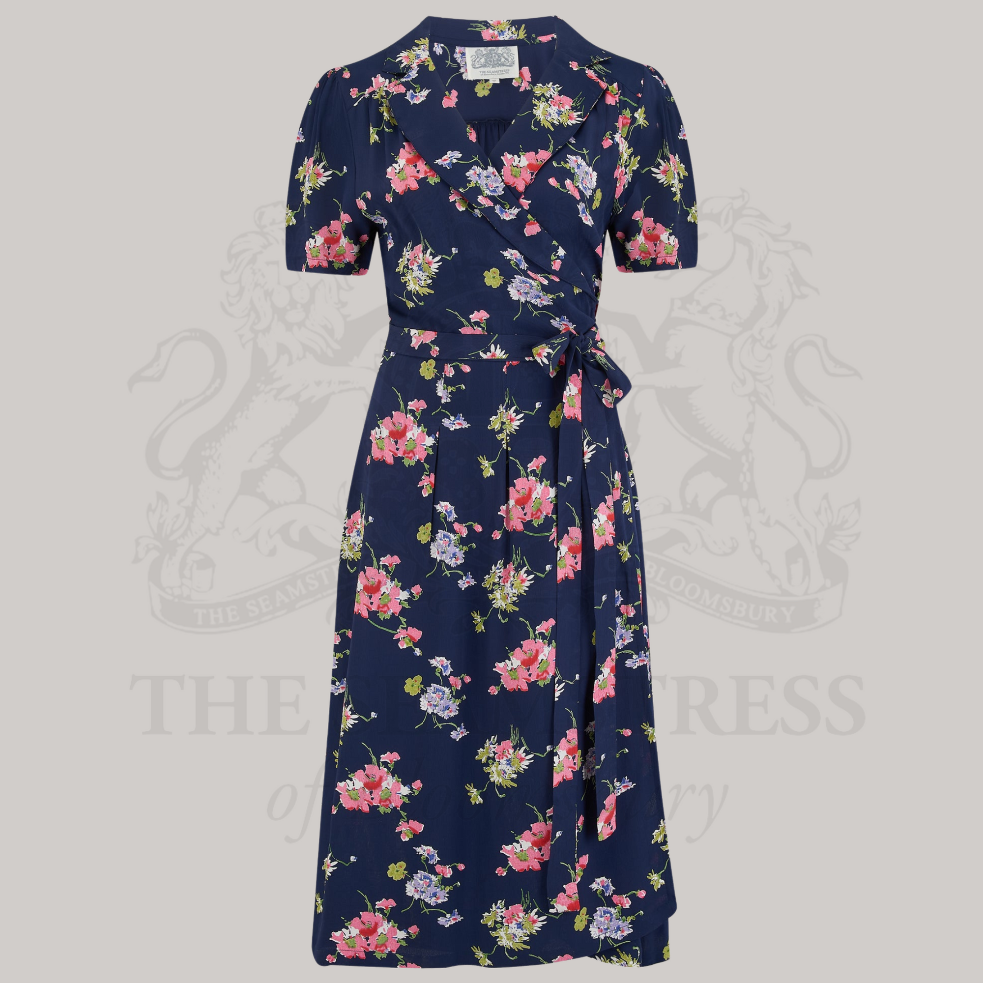 a navy floral print dress with a v-neck and short sleeves.