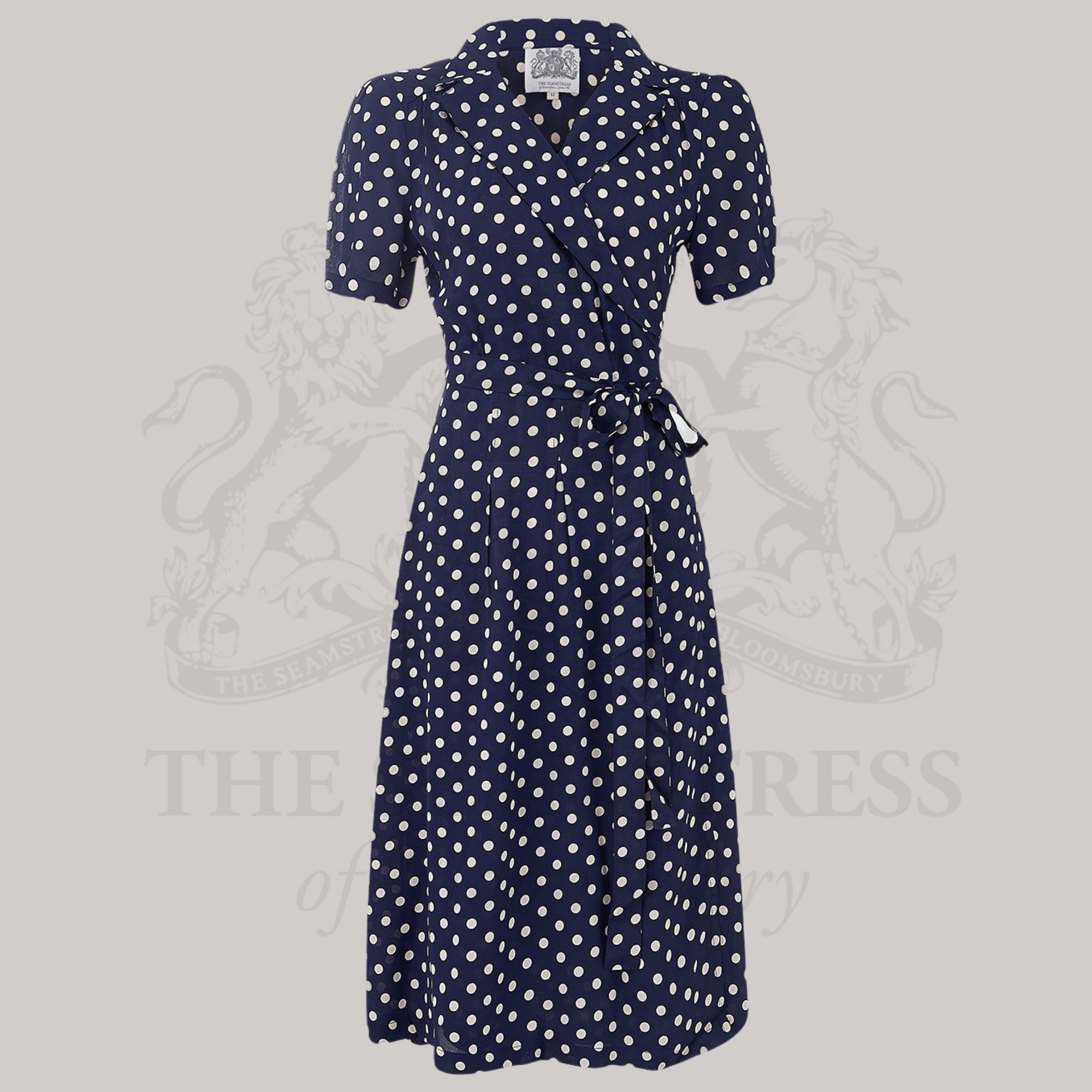 A 1940s-style navy dress with white polka dots, 