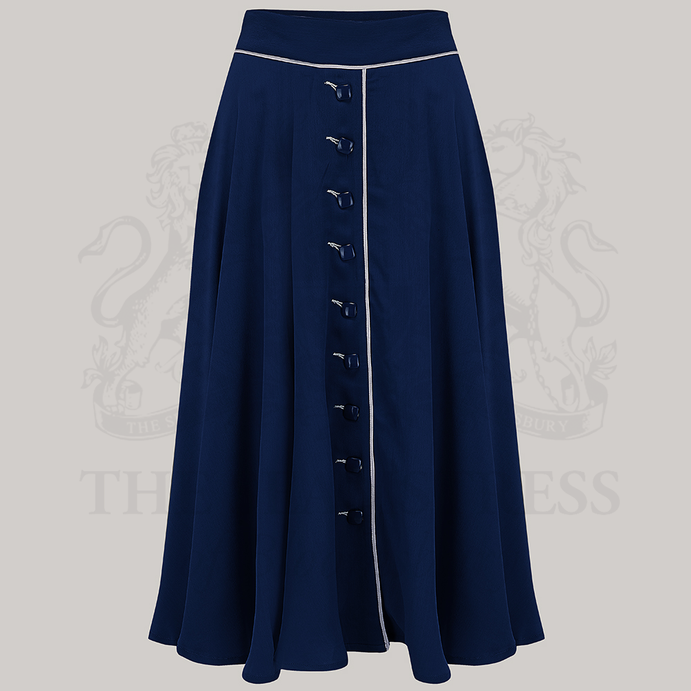 A full navy swing skirt with cream contrasting elements and buttons