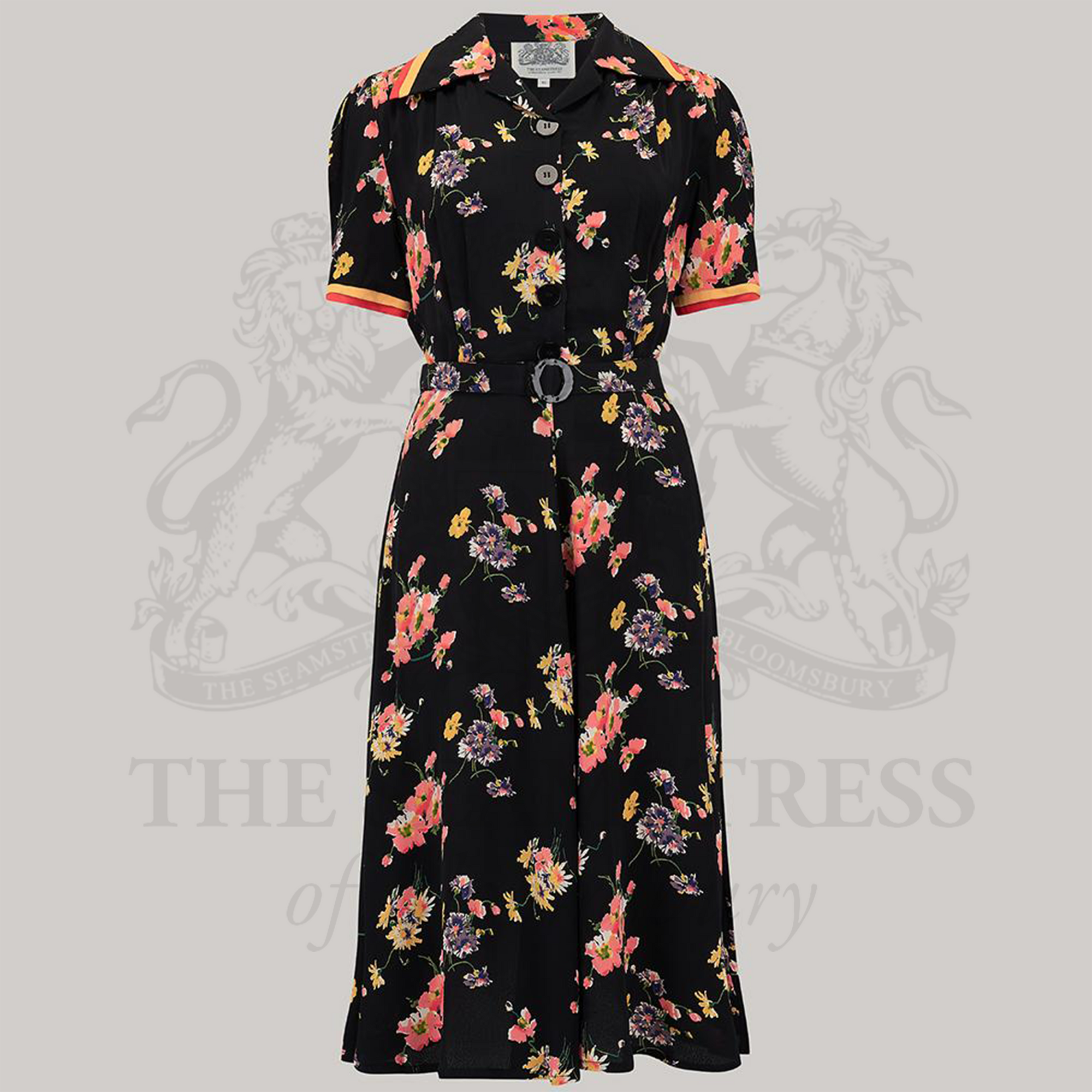 A black floral dress with short sleeves, a round neckline, and a belt.