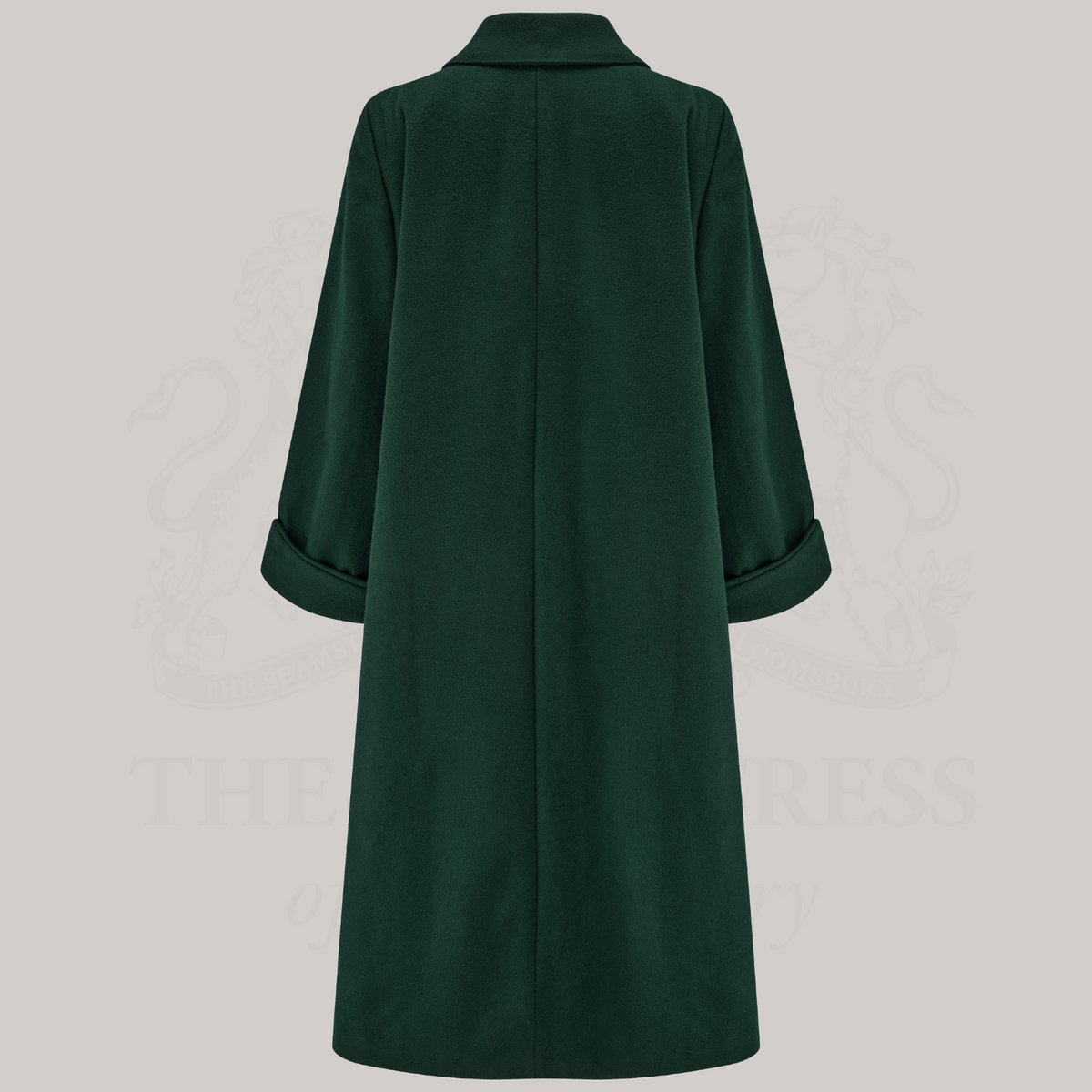 a long 1940s style coat in dark green, shown from the back