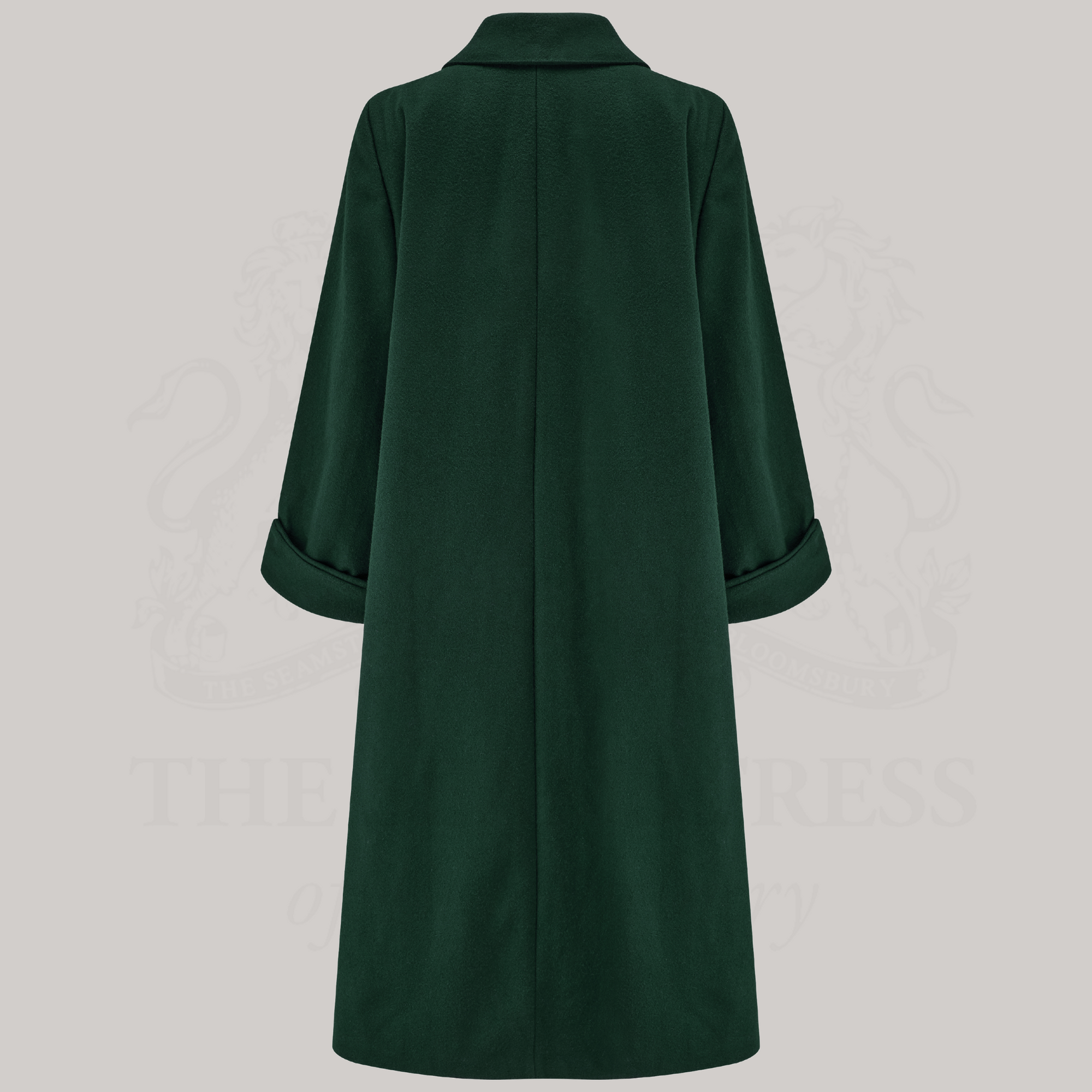 a long 1940s style coat in dark green, shown from the back