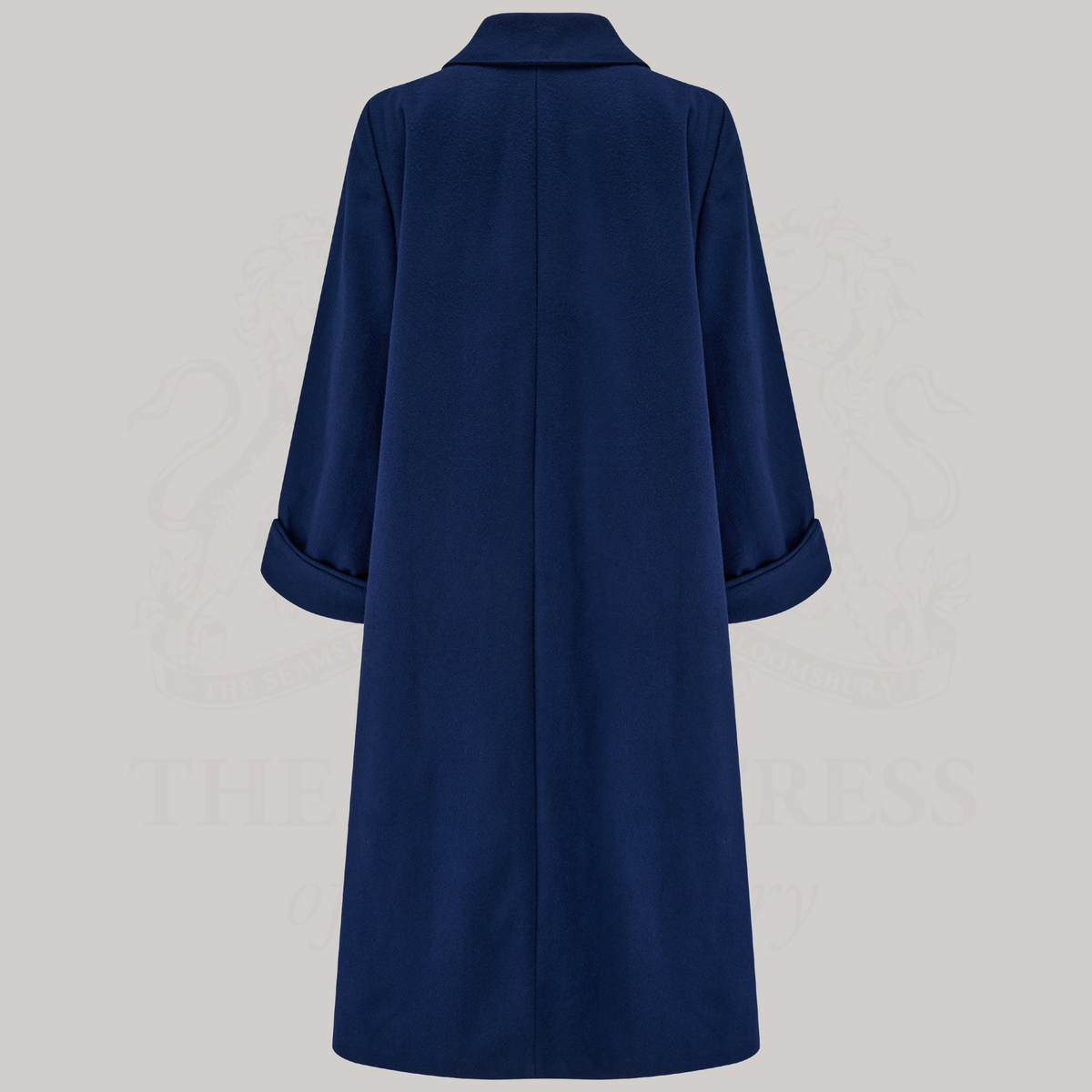 A 1940s style 43 inch long swing coat in navy shown from the back.