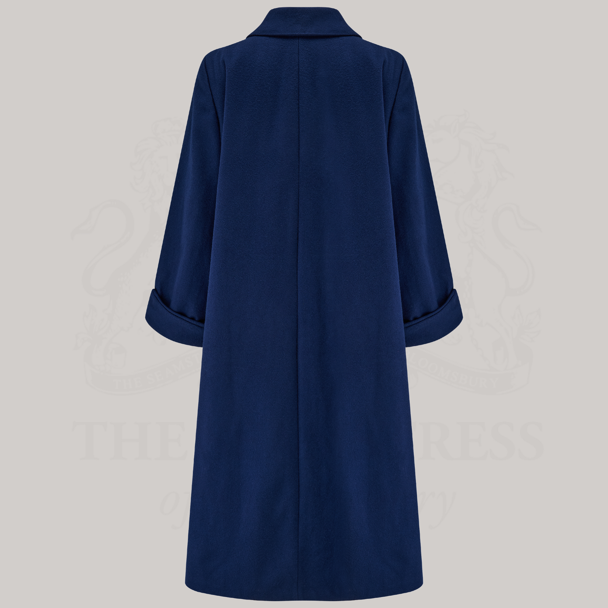 A 1940s style 43 inch long swing coat in navy shown from the back.
