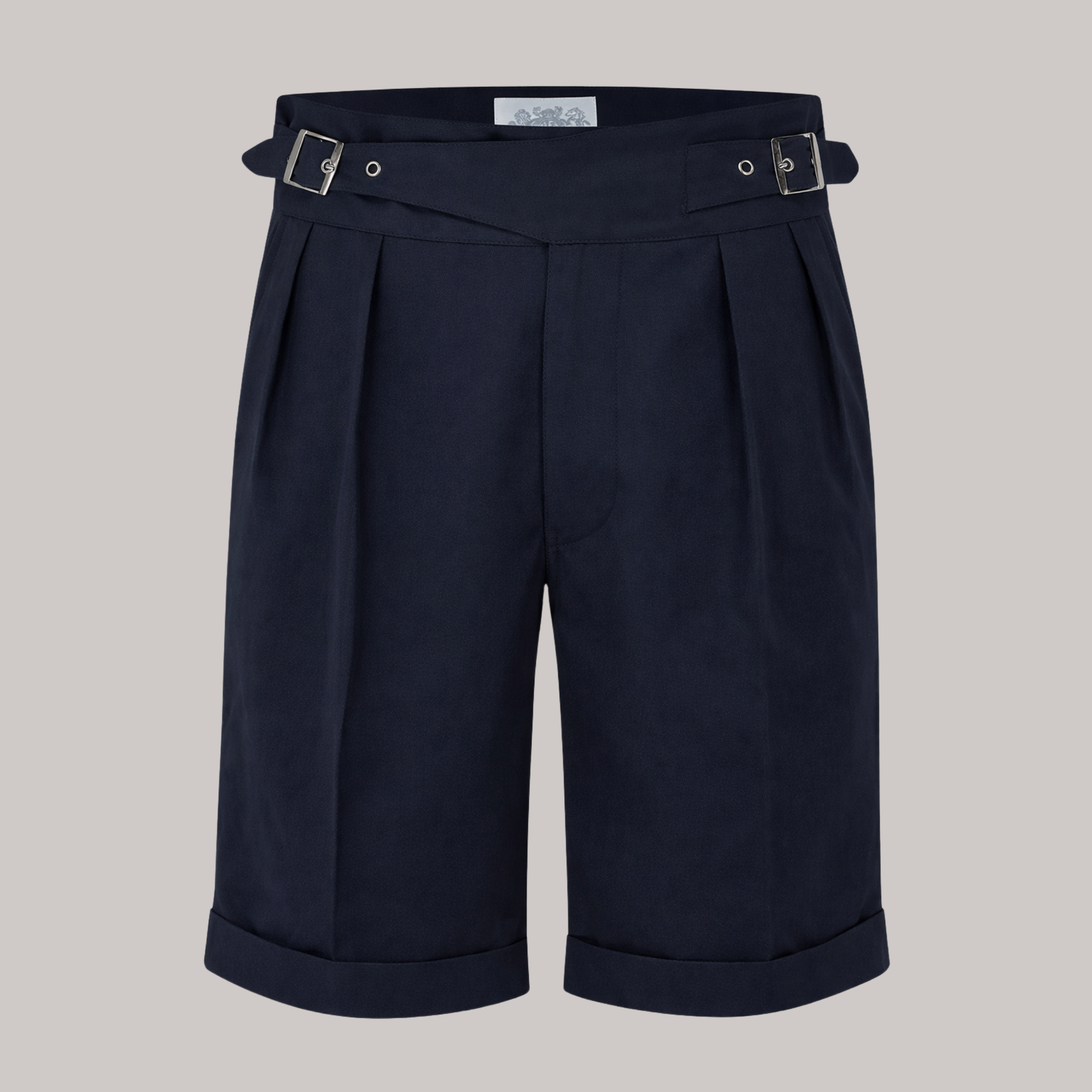 Navy blue shorts with belt on a light gray background
