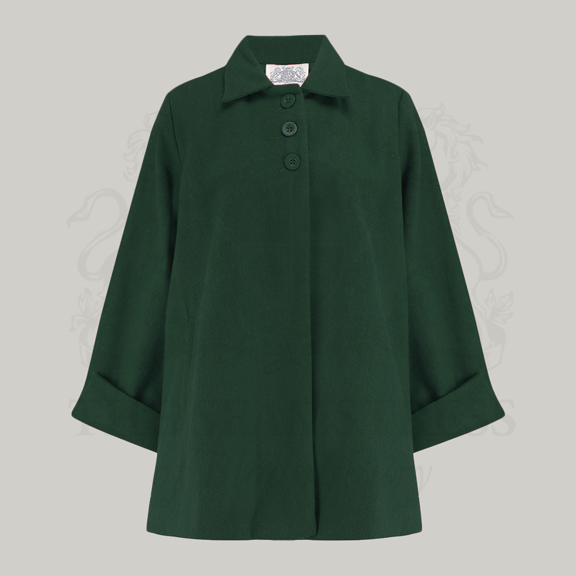 A vintage style green swing jacket with big turn-back cuffs, shoulder pads, and three big buttons at the front.