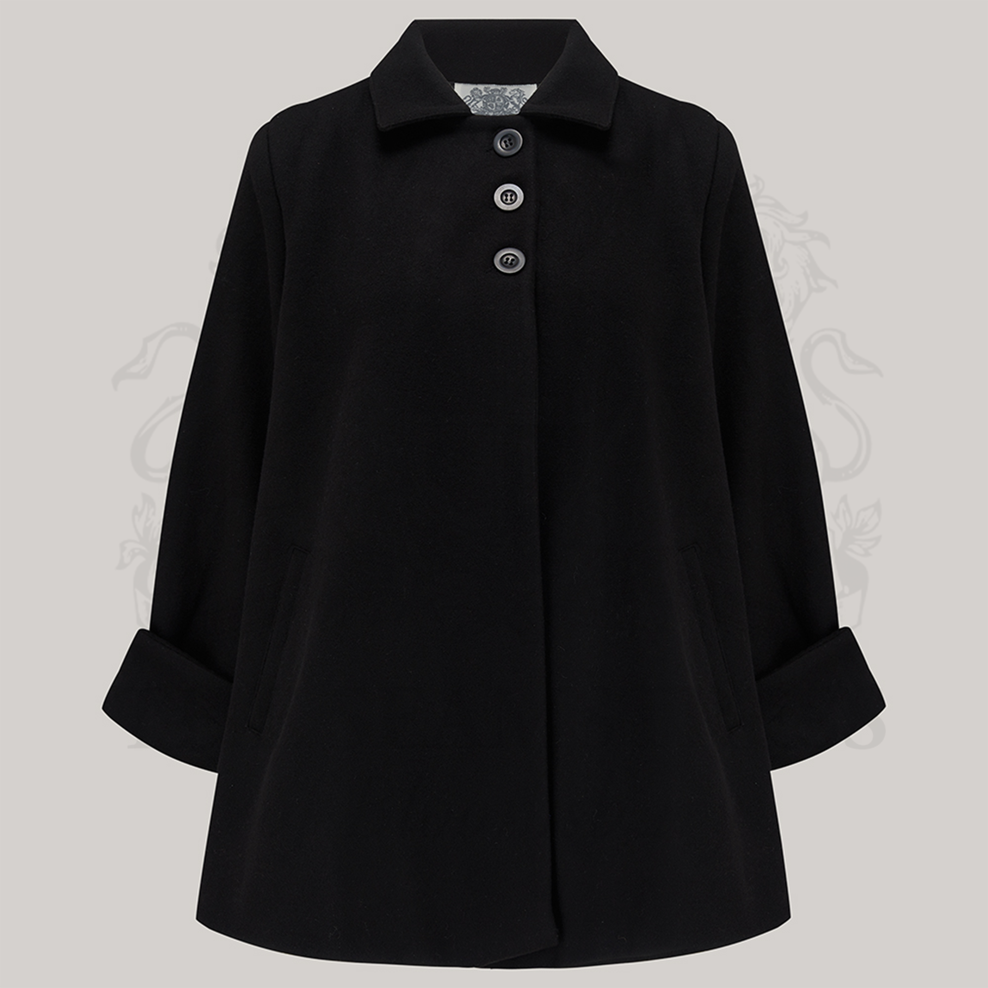 A black swing jacket with big turn-back cuffs, shoulder pads, and three big buttons at the front