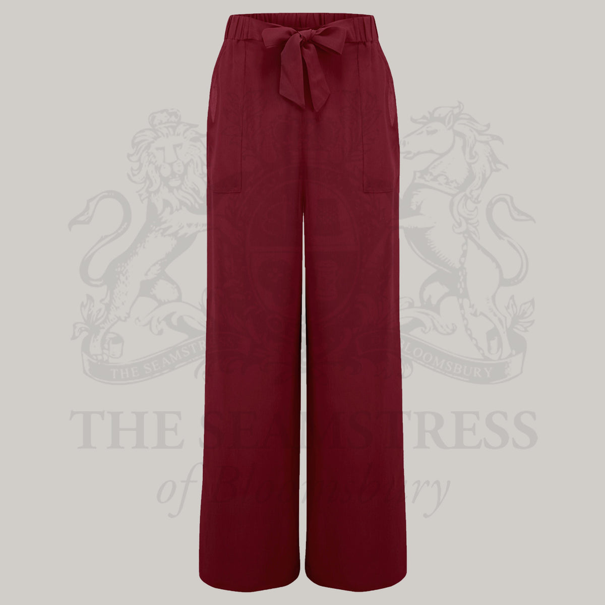 1940s style wrap burguny pyjamas. Consists of a full length gown with a revere collar and tie wrap waist, and wide leg elasticated waist trousers. 