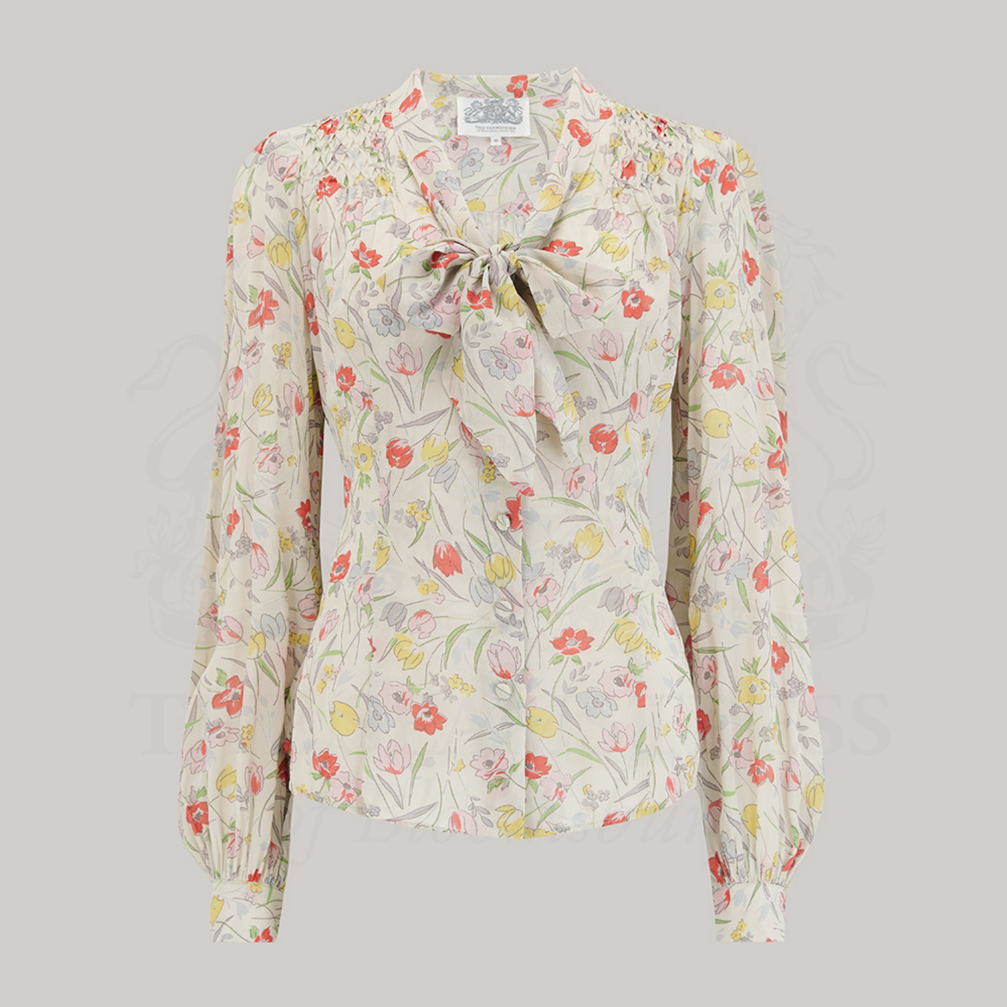 Floral long-sleeve blouse with a pussybow neckline.