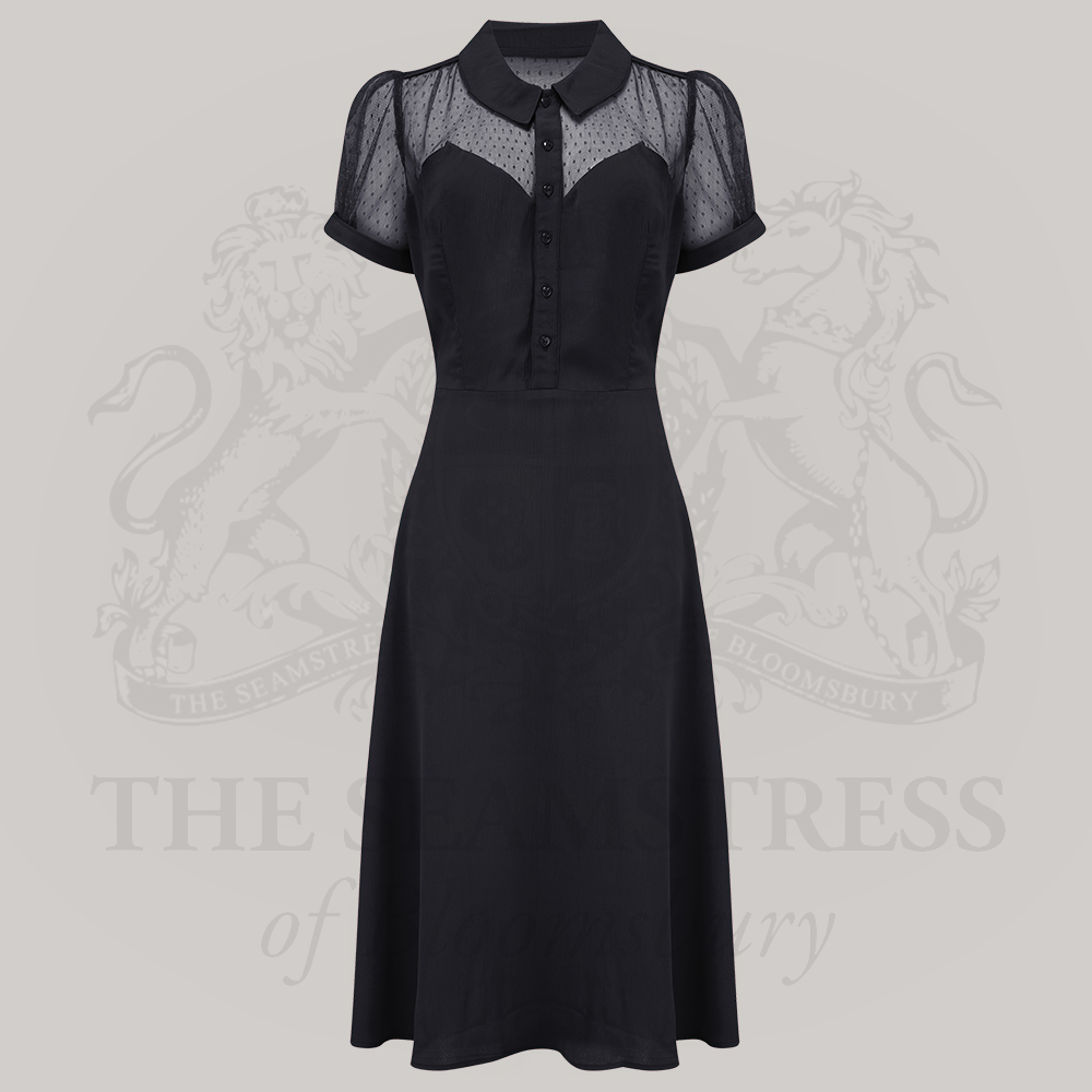 A luxurious black dress with a 1940s-inspired pointed flat collar, short sleeves, and net detailing. 