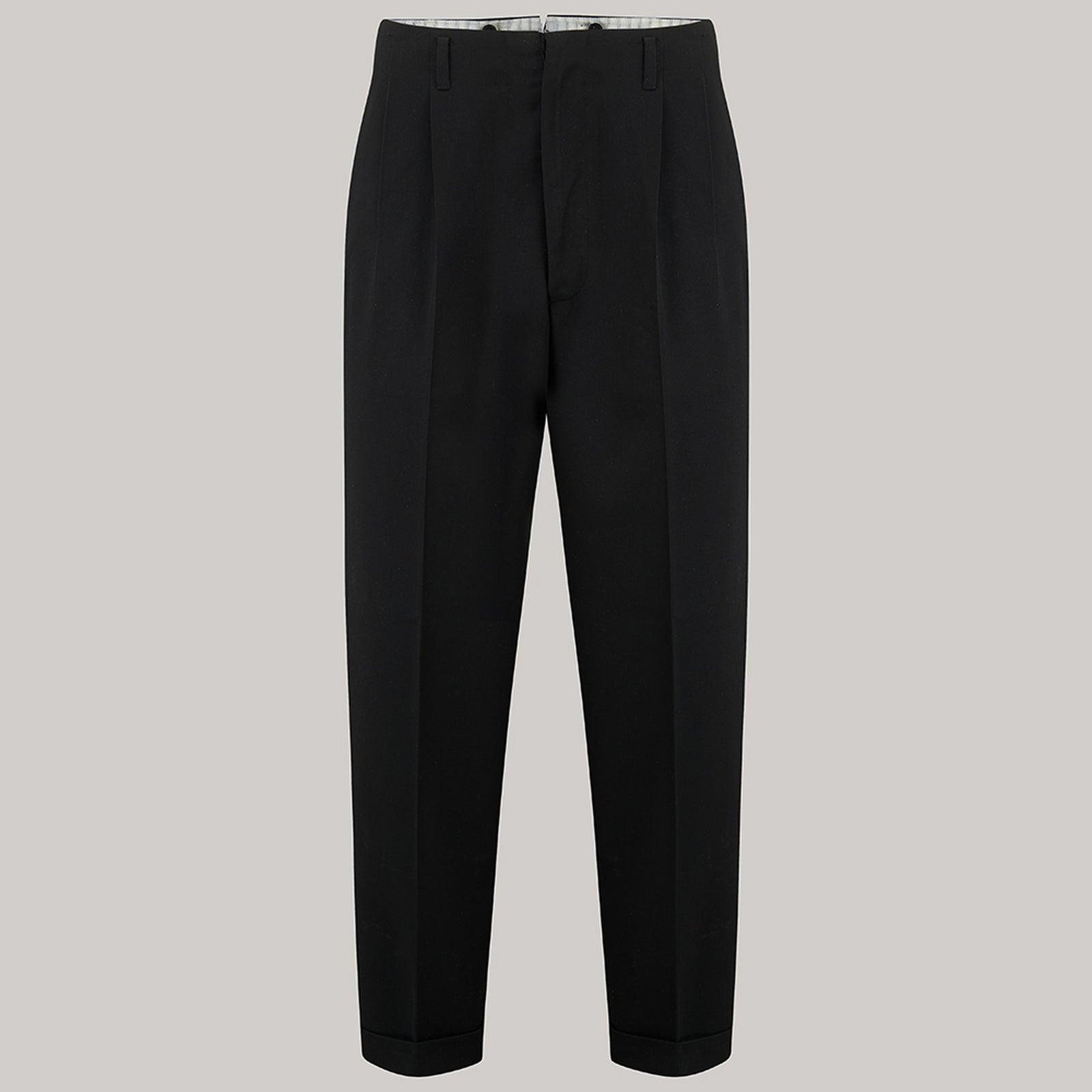 A 1950s pair of black men's trousers on a grey background.
