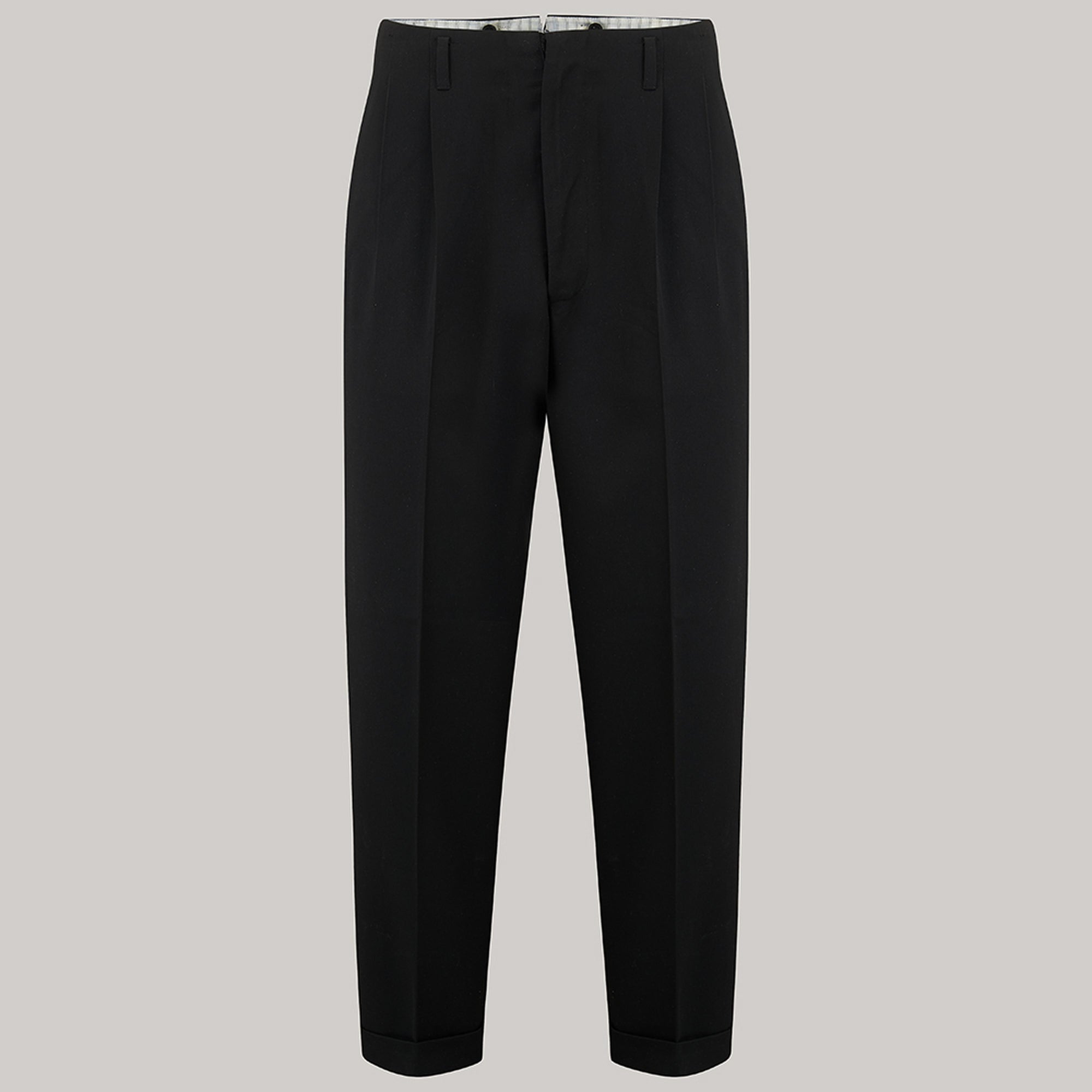 A 1950s pair of black men's trousers on a grey background.