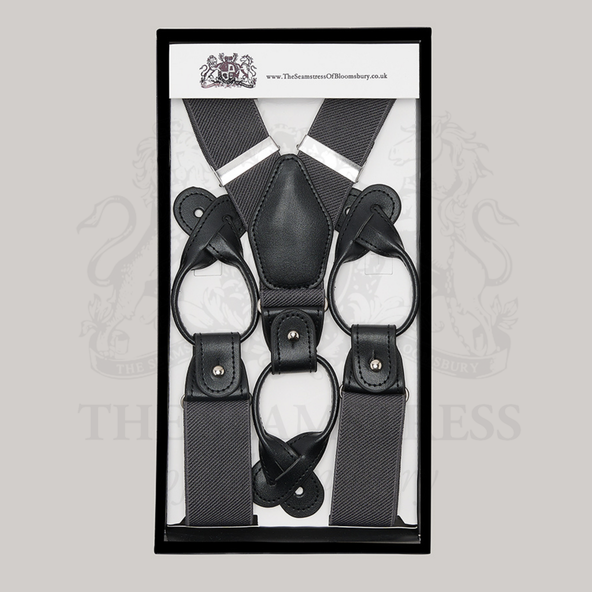 Pair of men's grey braces in branded packaging.